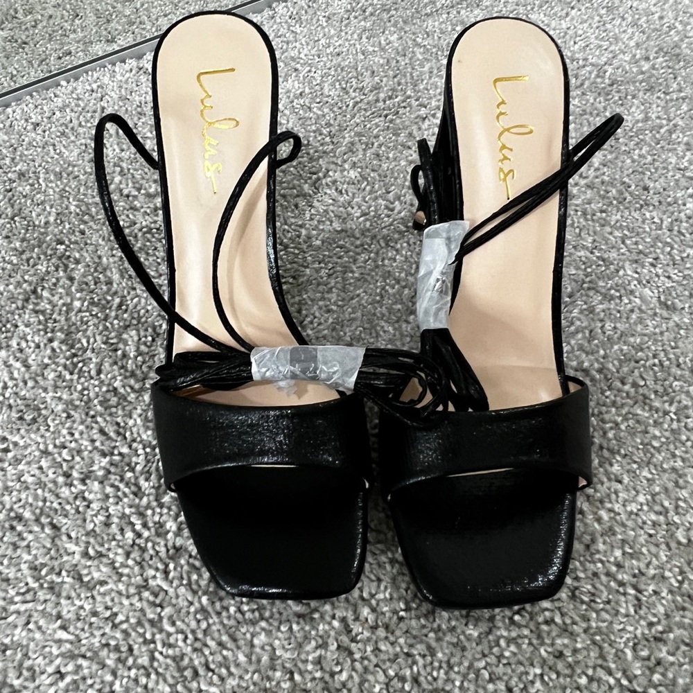 Black textured leather tie up heels